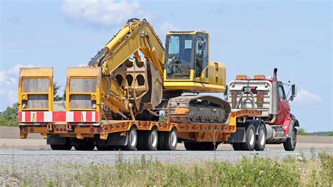 mini excavator hauling|equipment hauling services near me.